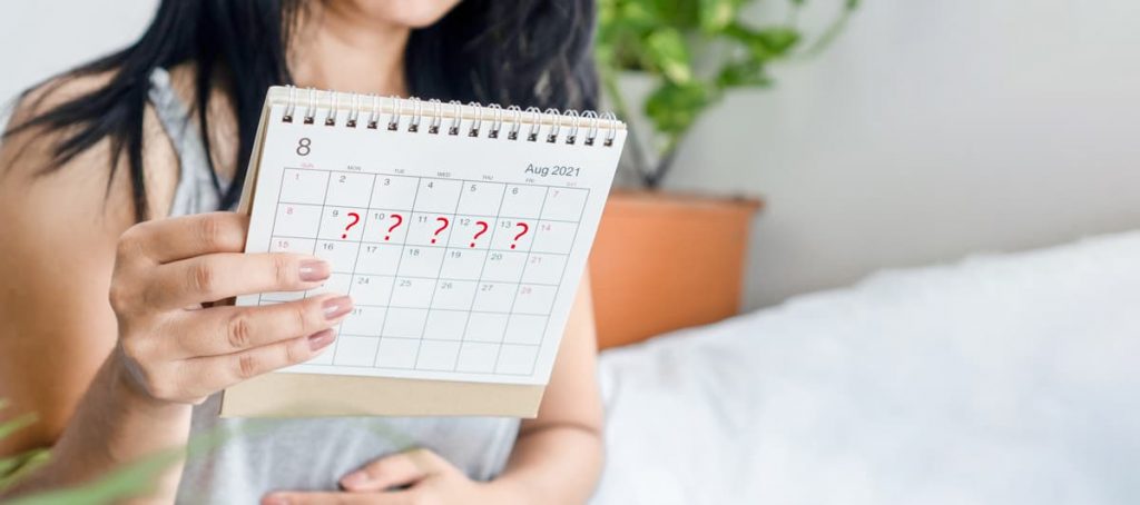 Woman holding a calendar signifying Irregular menstruation and the need of an endocrinology specialist in Idaho Falls or Pocatello.