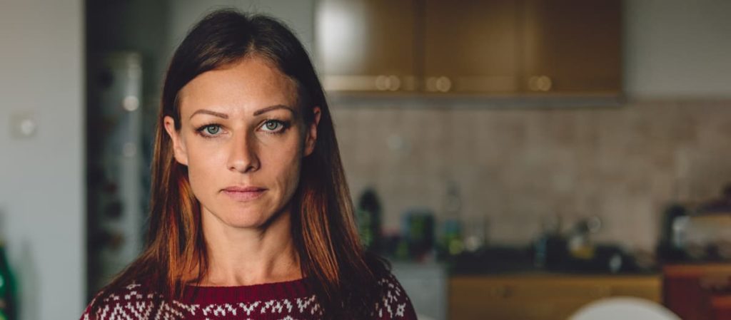 Woman looking grimly and needing the care of our endocrinology specialists to care for pituitary disorders in Idaho Falls and Pocatello.