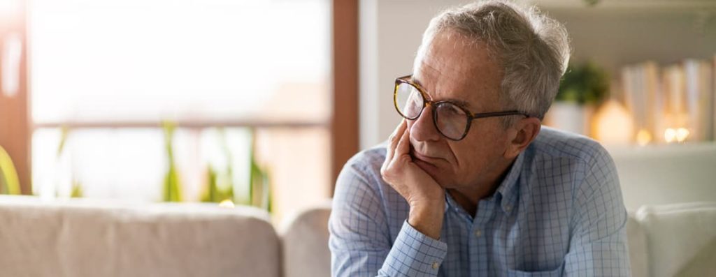Elderly man contemplating his cholesterol disorders as treated by diabetes doctors in Idaho Falls and Pocatello.