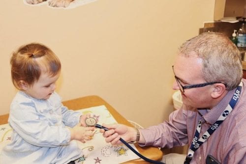 Dr. Smith with a toddler exploring pituitary gland treatments by this pediatric endocrinologist in Pocatello and Idaho Falls.