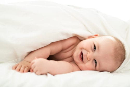 A happy baby with gynecomastia treatment by Dr. Joshua Smith, a pediatric endocrinologist in Pocatello and Idaho Falls.