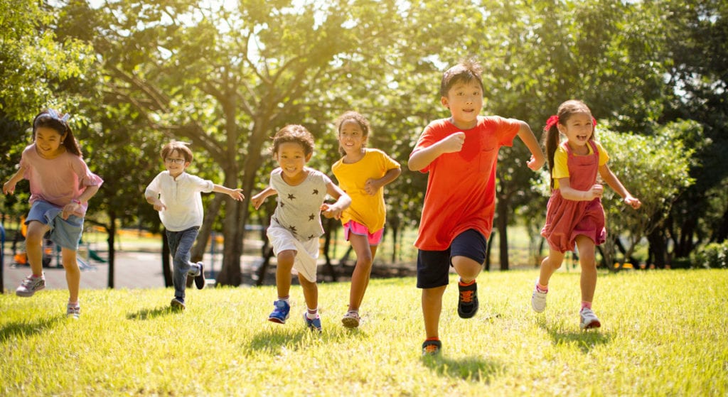Kids running in a park not worried about bone density issues after treatment from Dr. Josua Smith, the region's only pediatric endocrinologist in Idaho Falls and Pocatello.