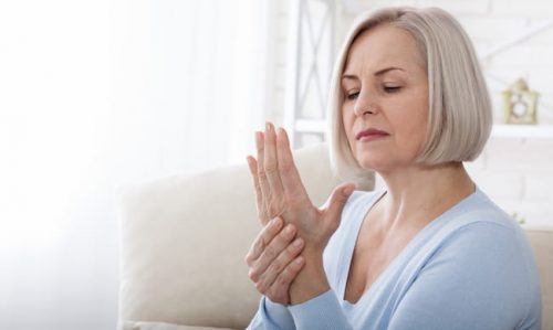 Woman with hand pain messaging wrist and needing to see our endocrinology specialists in Idaho Falls or Pocatello.