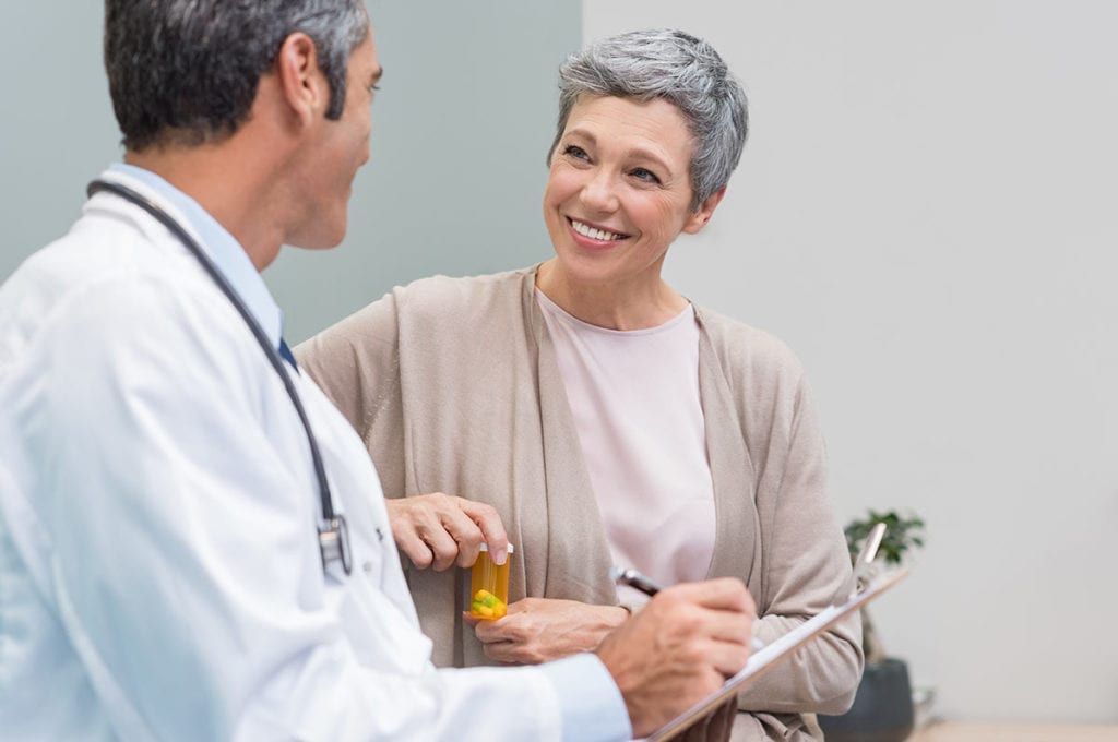 A doctor talking to a patient involved in a clinical study as part of our endocrine specialty and diabetes doctor care in Idaho Falls and Pocatello.