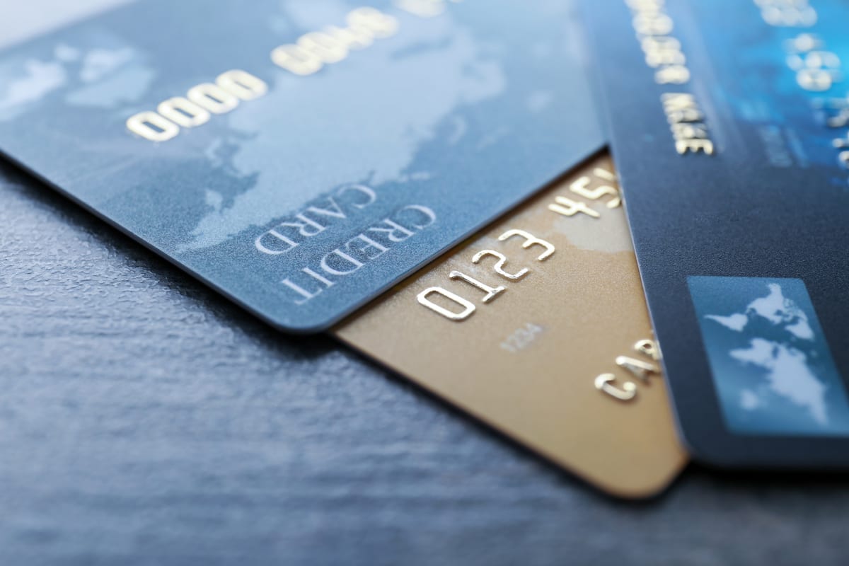 A few credit cards sitting on a table.