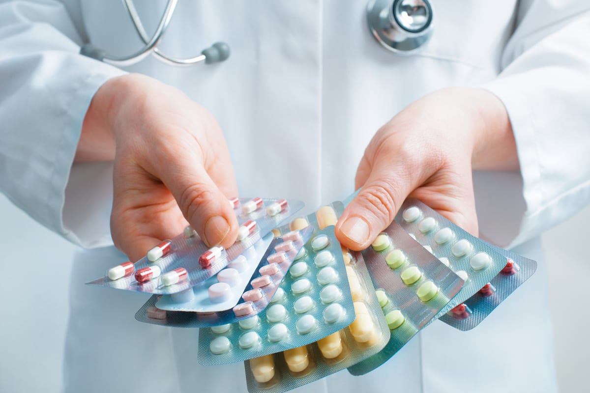 A doctor holding a few samples of diabetes medication, which can be prescribed as a diabetes doctor in Idaho Falls or Pocatello. 