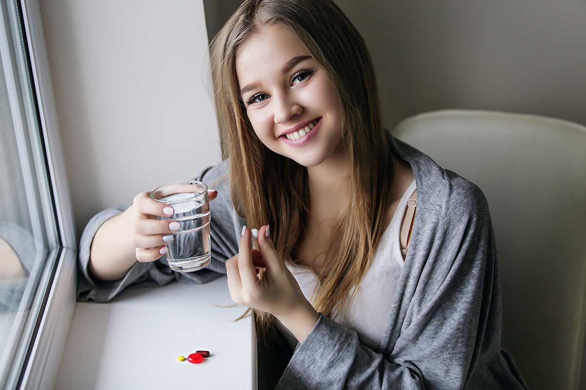 Young girl taking her medication received from her diabetes doctor in Idaho Falls or Pocatello.