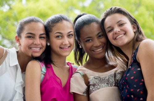 A group of young female friends discussing irregular menstruation symptoms being treated by Dr. Joshua Smith, a pediatric endocrinologist in Pocatello and Idaho Falls.